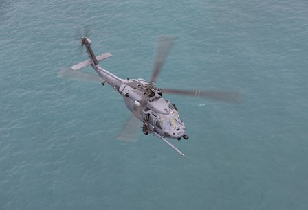 An HH-60G Pave Hawk Along the coastline of Okinawa, Japan (from above) by HIGH-G Productions/Stocktrek Images art print