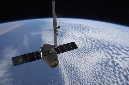 The SpaceX Dragon Cargo Craft Prior to being Released from the Canadarm2 by Stocktrek Images art print